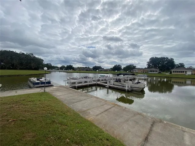 a view of a lake with houses in the back