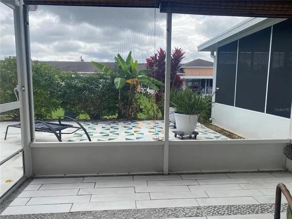 an entryway with table and chair