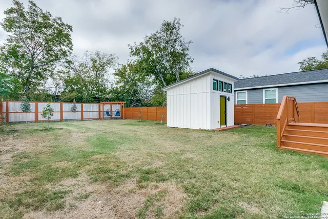 a backyard of a house with lots of green space