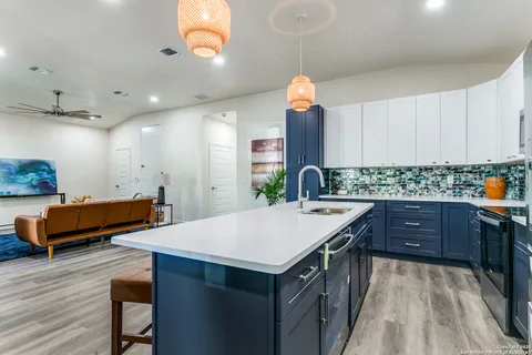 a kitchen with a sink and a refrigerator