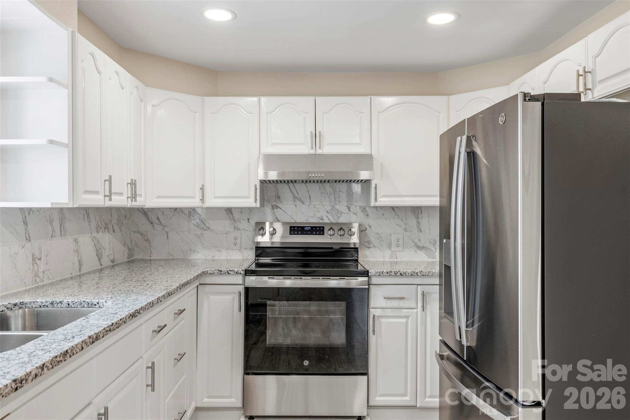 2480 Artz Road Salisbury, NC 28146 - Photo 20 of 33 a kitchen with a stove microwave and refrigerator