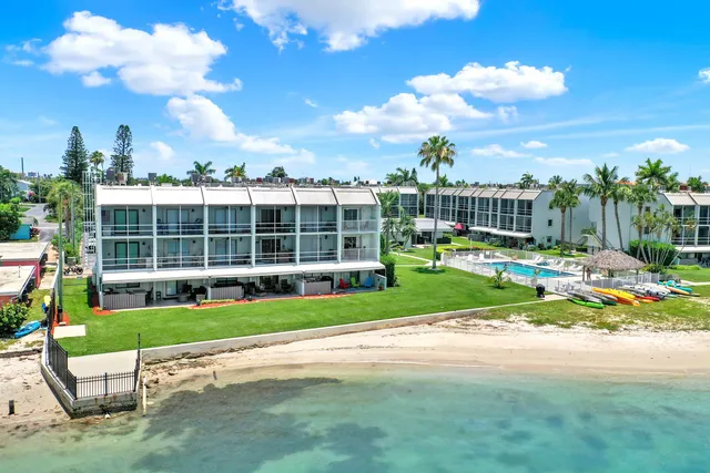 a view of a house with a yard in front of a house
