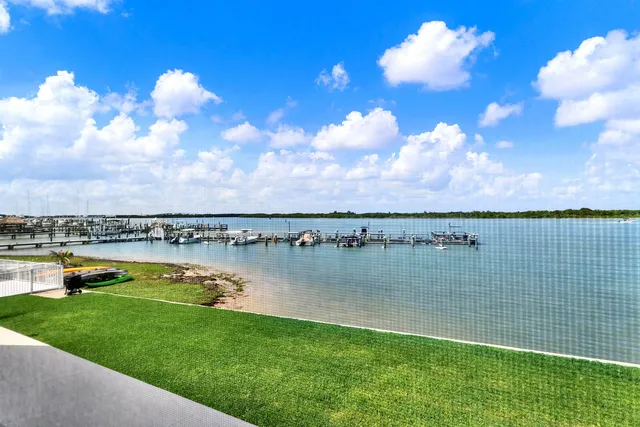 a view of a lake with a big yard