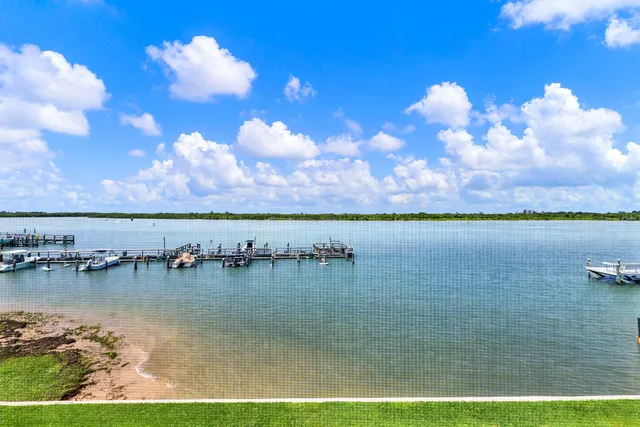 a view of a lake with a yard