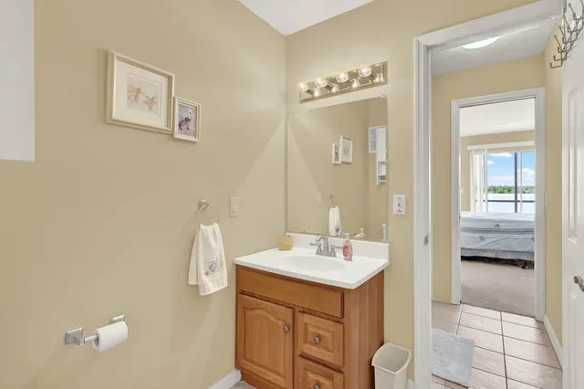 a bathroom with a sink a mirror and a shower