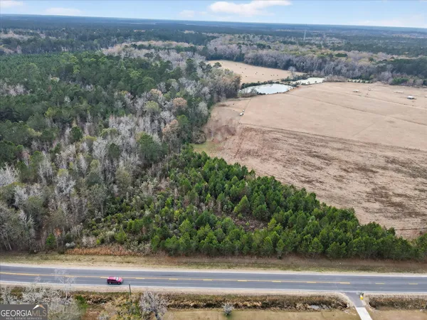 an aerial view of beach and yard