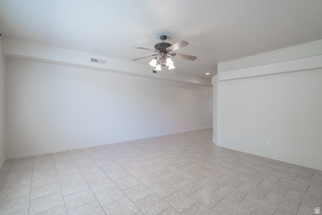 1735 West 540 North, Unit 1805 St. George, UT 84770 - Photo 8 of 64 Spacious room featuring light-toned tile flooring, white walls, and a ceiling fan with integrated lighting