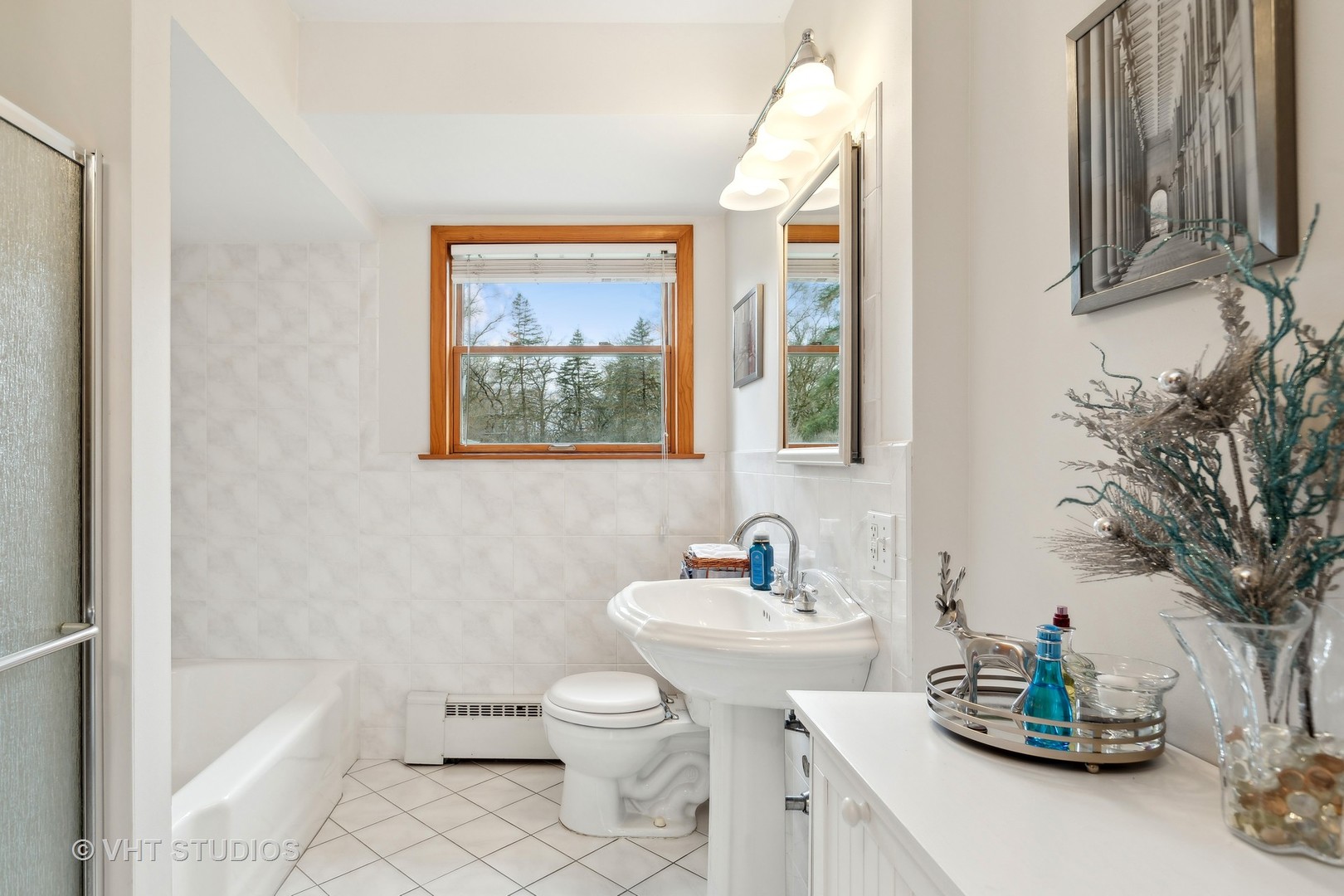 7025 Willow Springs Road Long Grove, IL 60060 - Photo 6 of 34 a bathroom with a sink toilet and shower