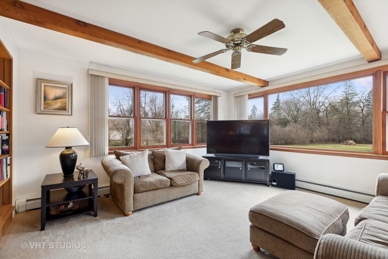7025 Willow Springs Road Long Grove, IL 60060 - Photo 8 of 34 a living room with furniture and a flat screen tv