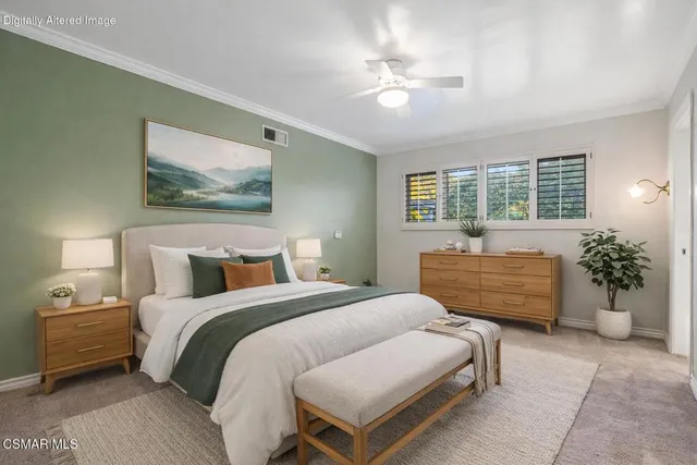 a bedroom with a bed and ceiling fan