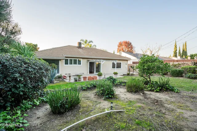 a house view with a garden space