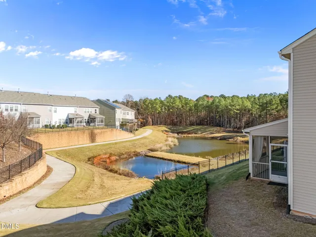 a view of a swimming pool with an outdoor seating
