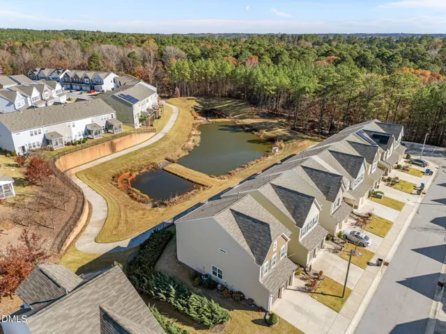 a view of a swimming pool with lounge chairs
