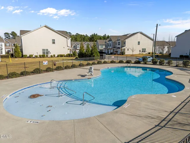 a view of a living room and kitchen