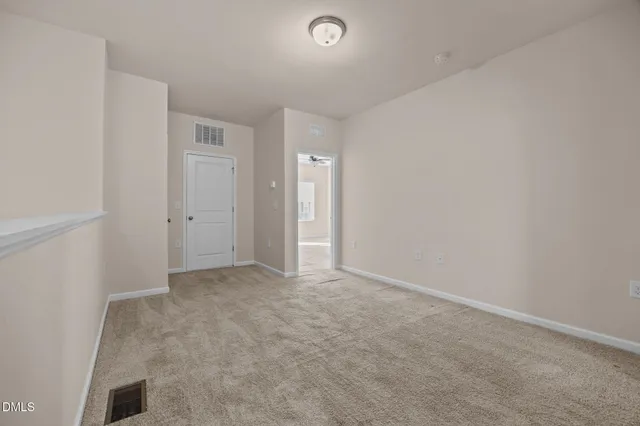 an empty room with closet area