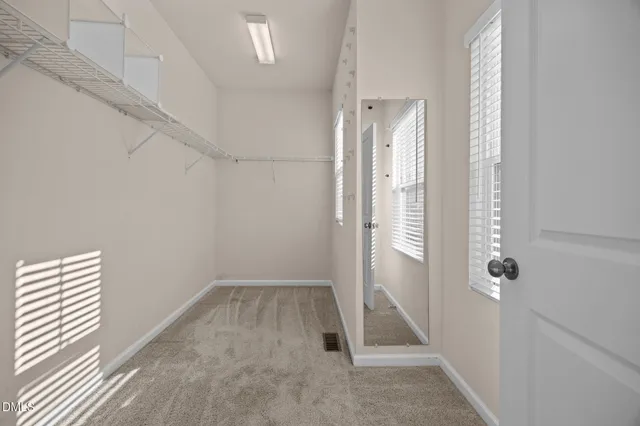 a view of a bathroom with a glass door shower