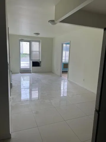 a view of an empty room and window