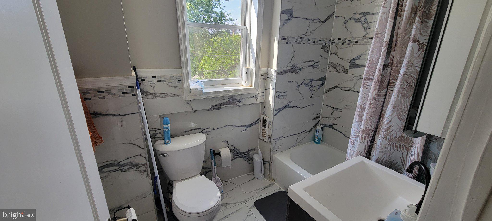 209 North 10th Street Darby, PA 19023 - Photo 17 of 26 Modern bathroom with elegant finishes.
