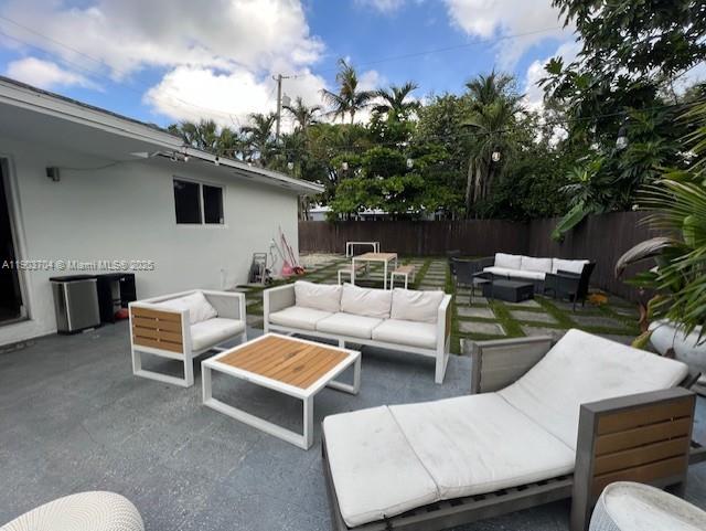 201 Northeast 48th Street Miami, FL 33137 - Photo 12 of 19 a outdoor living space with furniture and a potted plant