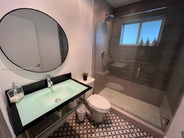 201 Northeast 48th Street Miami, FL 33137 - Photo 17 of 19 a bathroom with a toilet a sink and shower