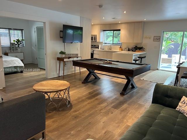 201 Northeast 48th Street Miami, FL 33137 - Photo 2 of 19 a living room with furniture a coffee table and a flat screen tv