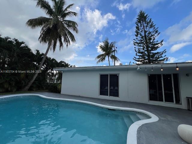 201 Northeast 48th Street Miami, FL 33137 - Photo 3 of 19 a front view of a house with a garden