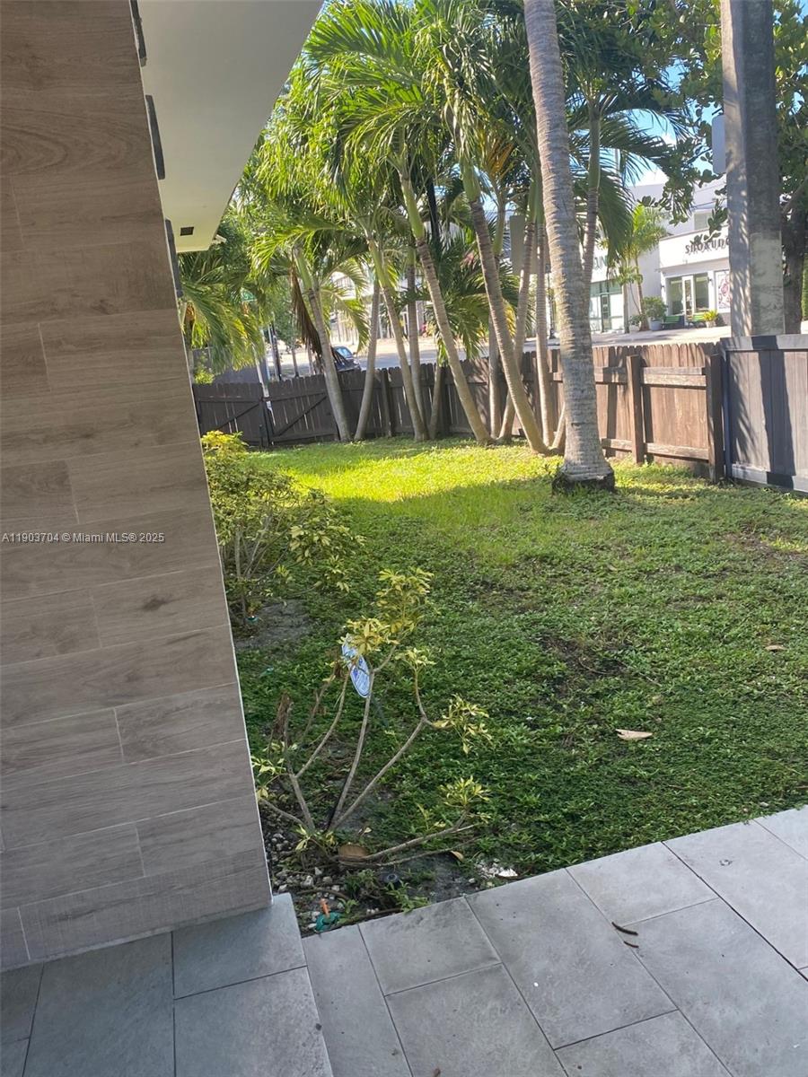 201 Northeast 48th Street Miami, FL 33137 - Photo 4 of 19 a view of a yard with large trees