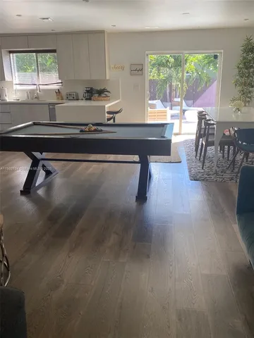 a living room with furniture a window and a table