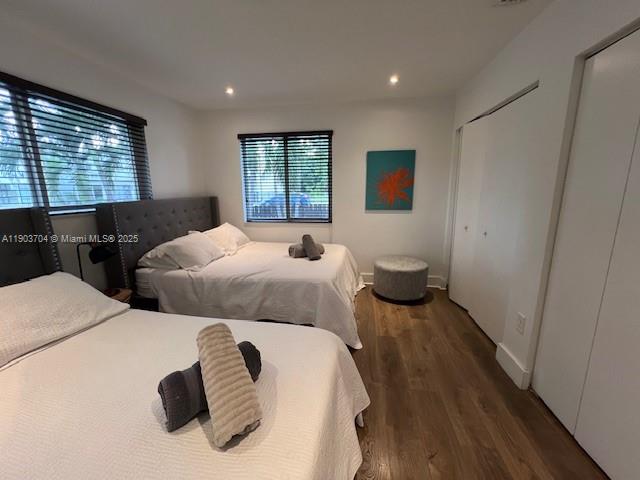 201 Northeast 48th Street Miami, FL 33137 - Photo 8 of 19 a bedroom with two beds and a window