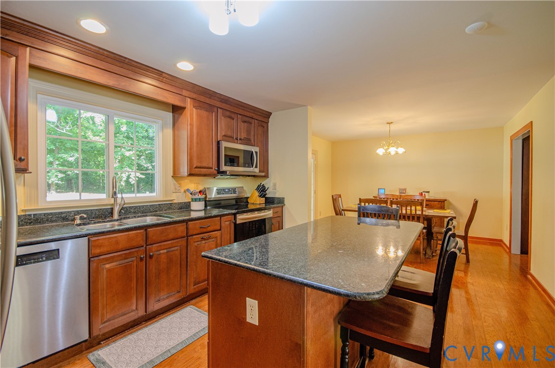 12500 Musical Lane Midlothian, VA 23113 - Photo 12 of 51 Kitchen with wood cabinetry, stainless steel appli