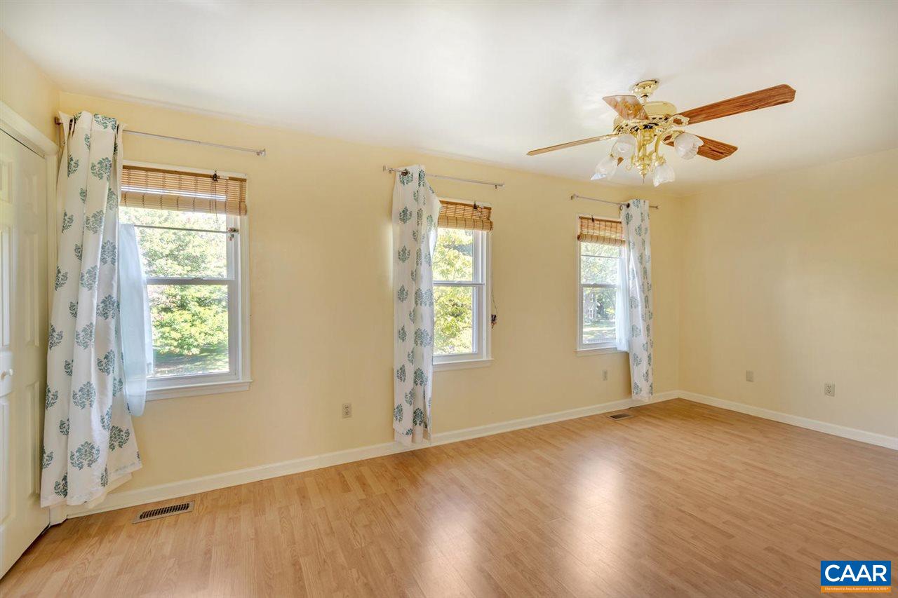 1463 Minor Ridge Court Charlottesville, VA 22901 - Photo 14 of 24 a view of an empty room with window and wooden floor
