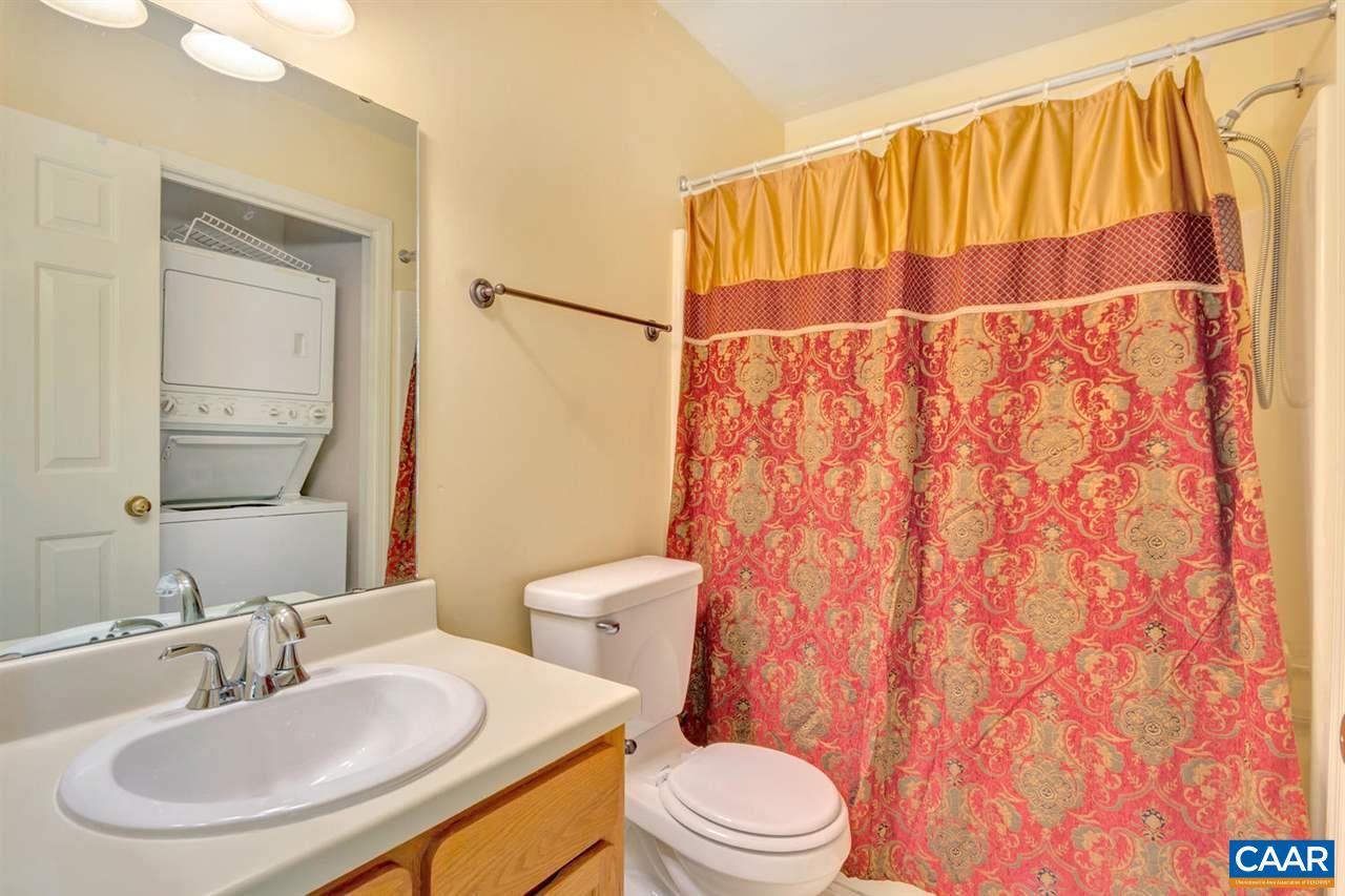 1463 Minor Ridge Court Charlottesville, VA 22901 - Photo 17 of 24 a bathroom with a sink a toilet and shower curtain