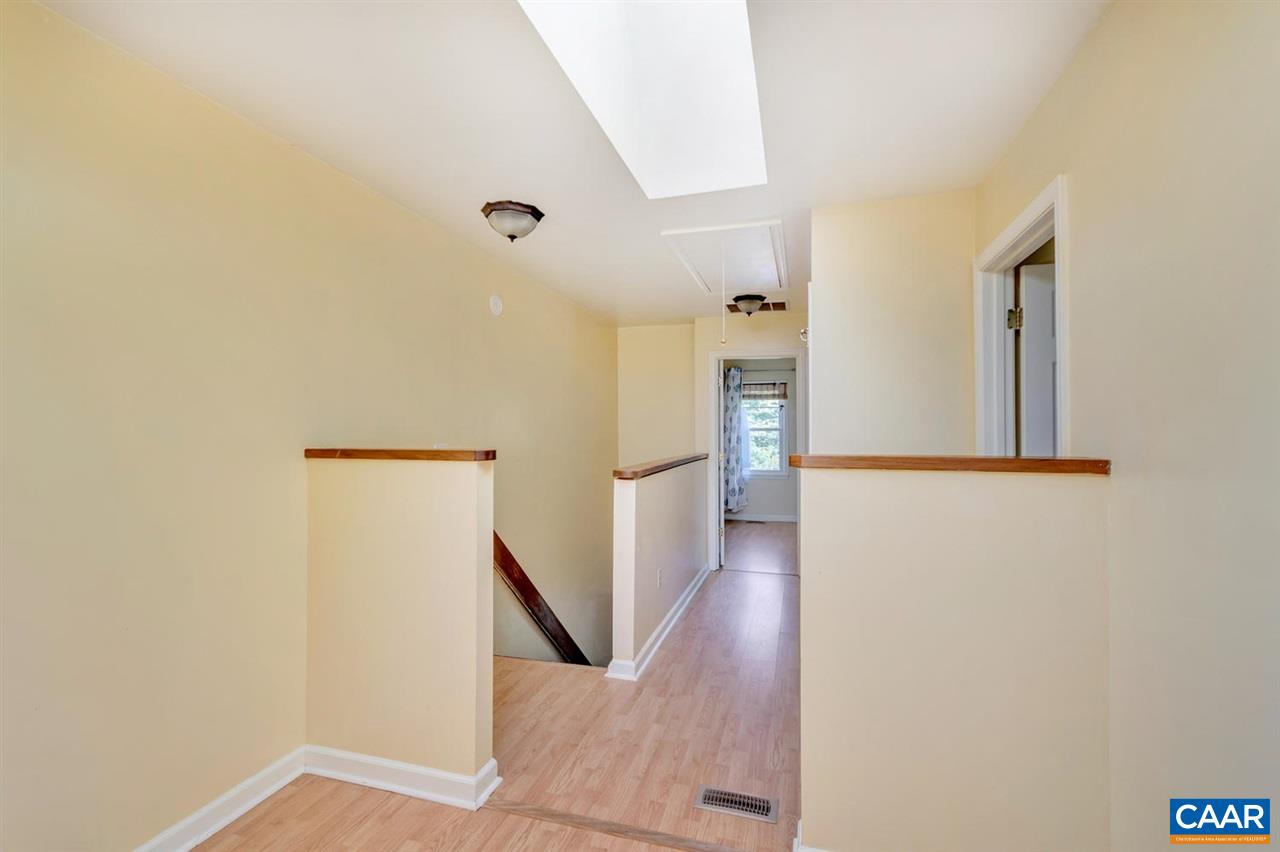 1463 Minor Ridge Court Charlottesville, VA 22901 - Photo 20 of 24 a view of a hallway with wooden floor and staircase