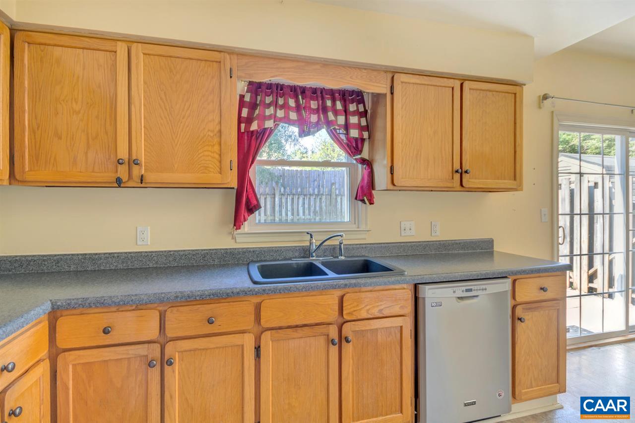 1463 Minor Ridge Court Charlottesville, VA 22901 - Photo 5 of 24 a kitchen with granite countertop a sink cabinets and window