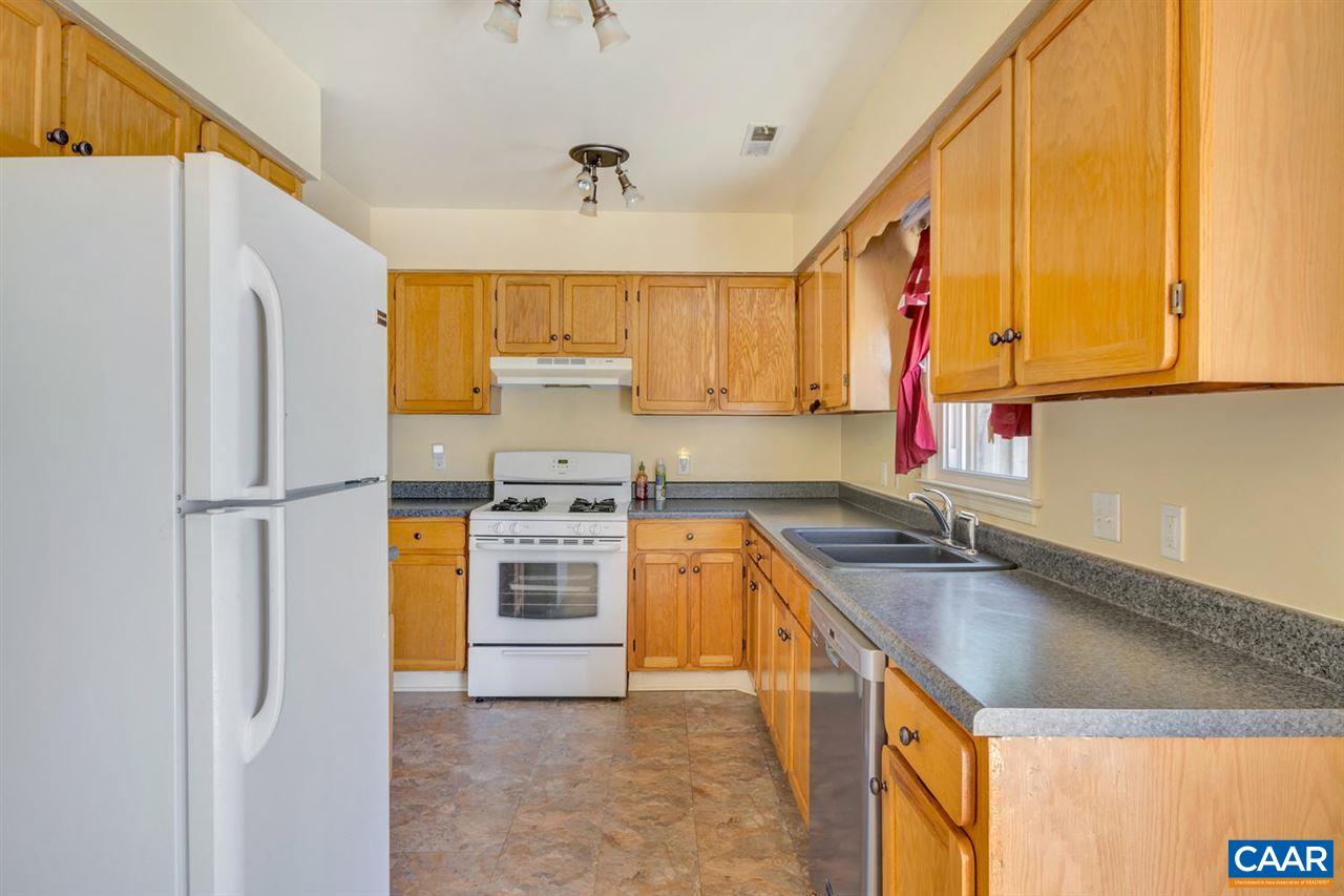 1463 Minor Ridge Court Charlottesville, VA 22901 - Photo 7 of 24 a kitchen with a sink a stove cabinets and a refrigerator