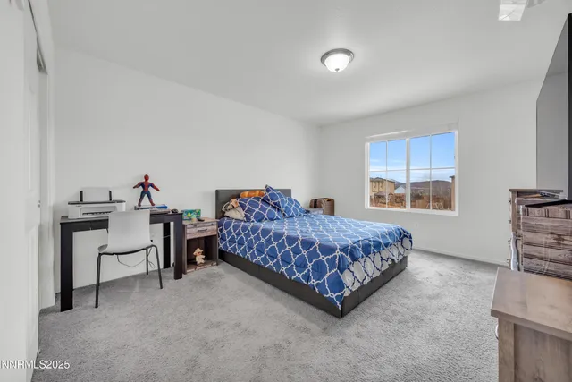 a bed room with a bed and a window