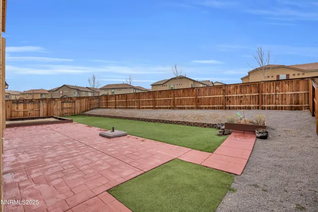 a view of a street with a big yard