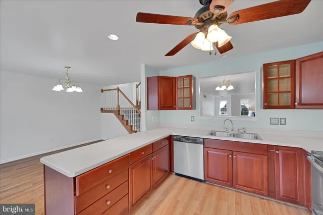 a kitchen with a sink cabinets and window