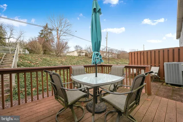 a view of two chairs in the balcony
