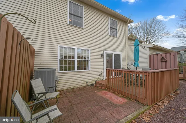 a view of a house with wooden fence