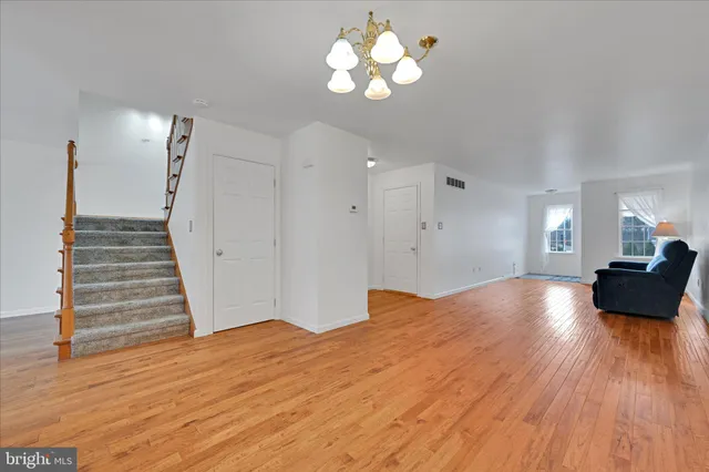 a view of a room with wooden floor