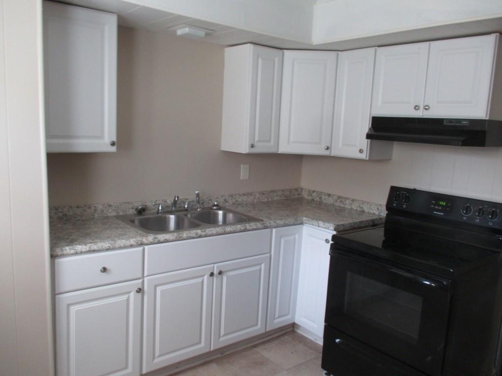 94 McCarrell Road Hickory, PA 15340 - Photo 17 of 22 a kitchen with granite countertop white cabinets and a sink