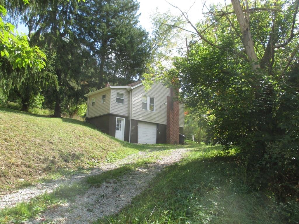 94 McCarrell Road Hickory, PA 15340 - Photo 2 of 22 front view of a house with a big yard