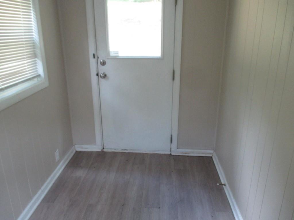 94 McCarrell Road Hickory, PA 15340 - Photo 8 of 22 an empty room with wooden floor and windows