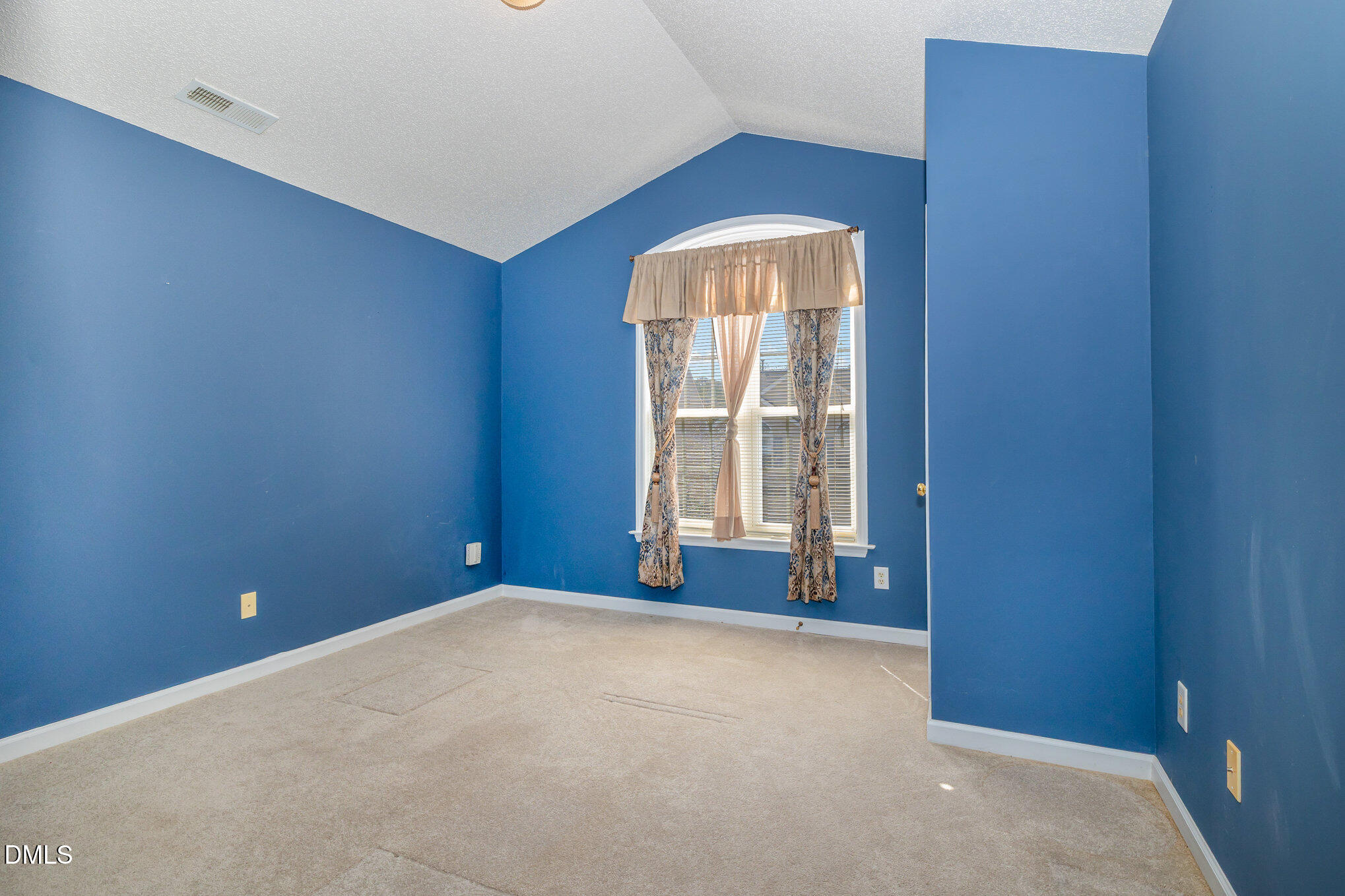2116 Metacomet Way Raleigh, NC 27604 - Photo 16 of 24 a view of an empty room with a window