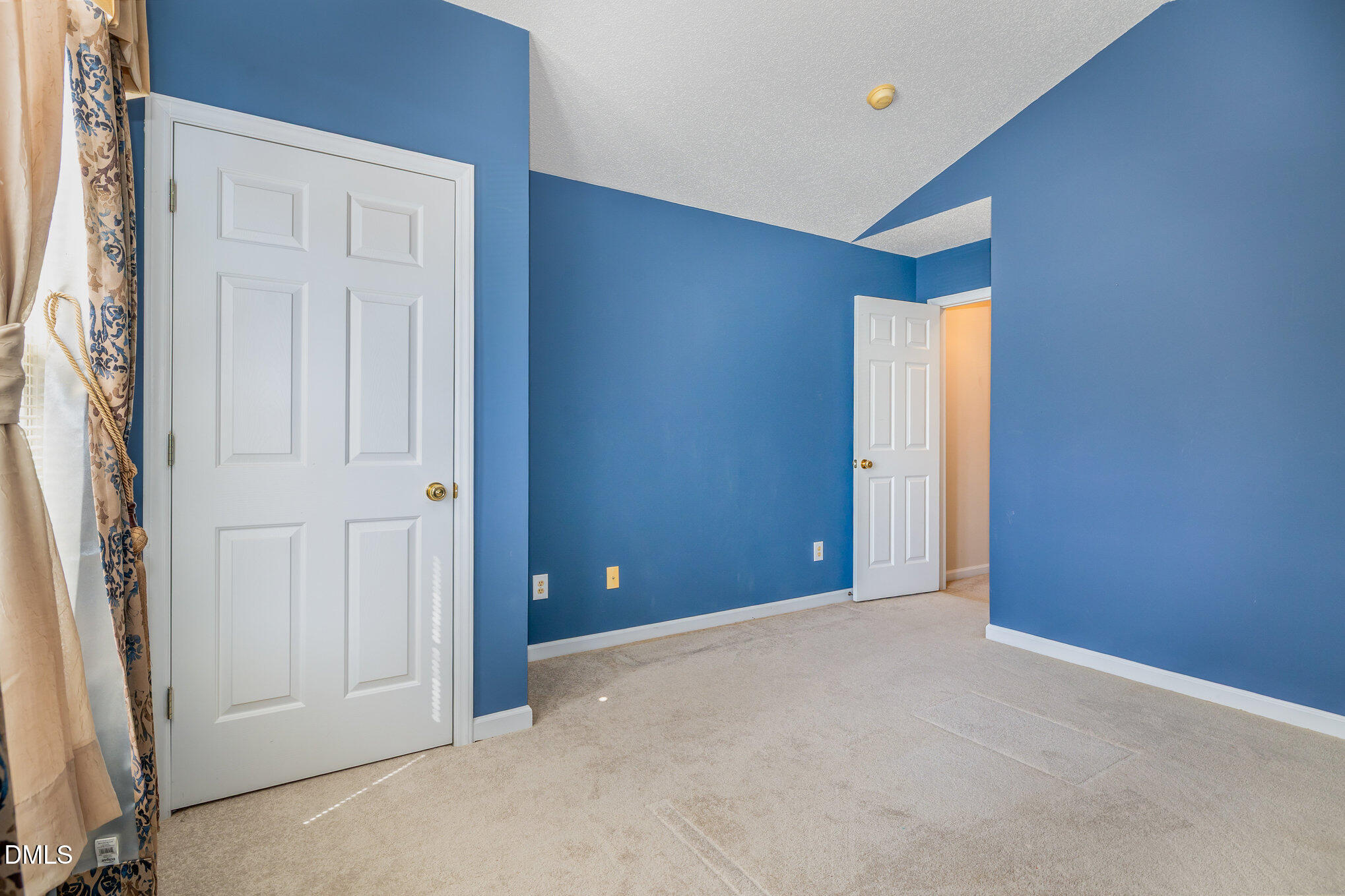 2116 Metacomet Way Raleigh, NC 27604 - Photo 17 of 24 an empty room with closet and windows