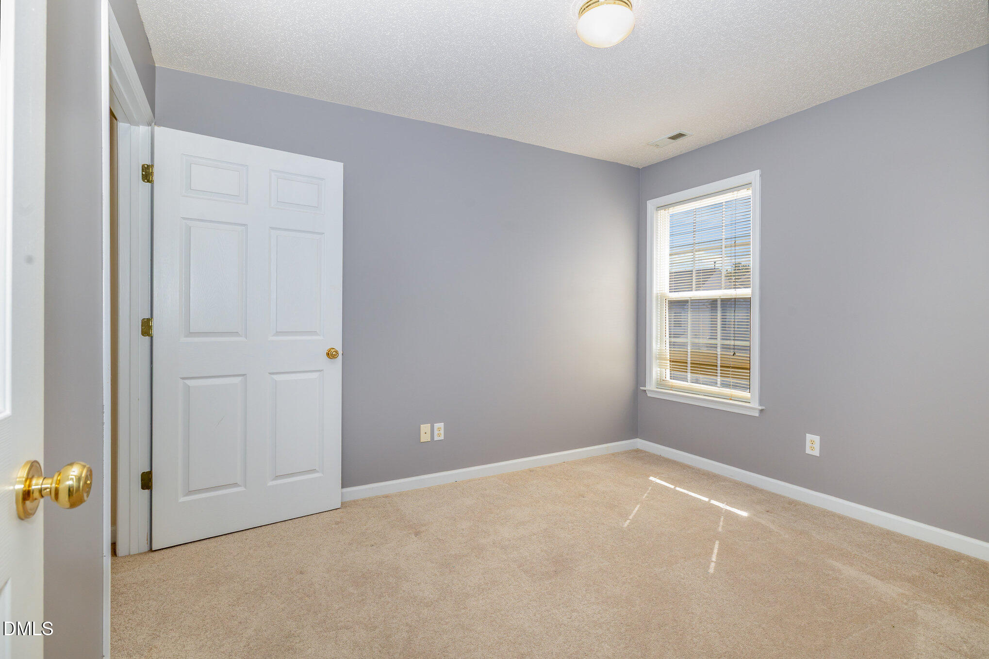 2116 Metacomet Way Raleigh, NC 27604 - Photo 18 of 24 an empty room with windows and closet