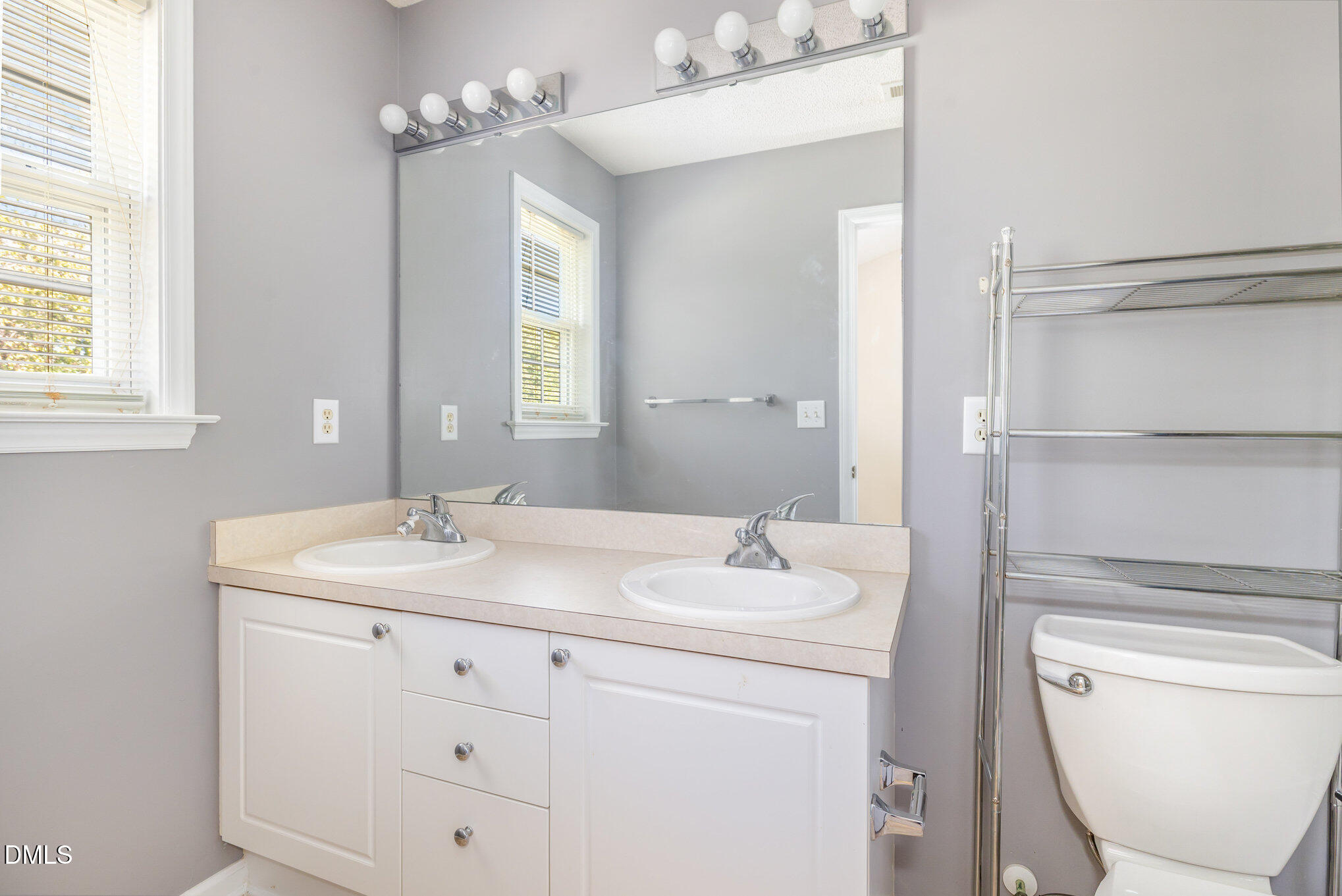 2116 Metacomet Way Raleigh, NC 27604 - Photo 20 of 24 a bathroom with a toilet sink vanity granite and mirror