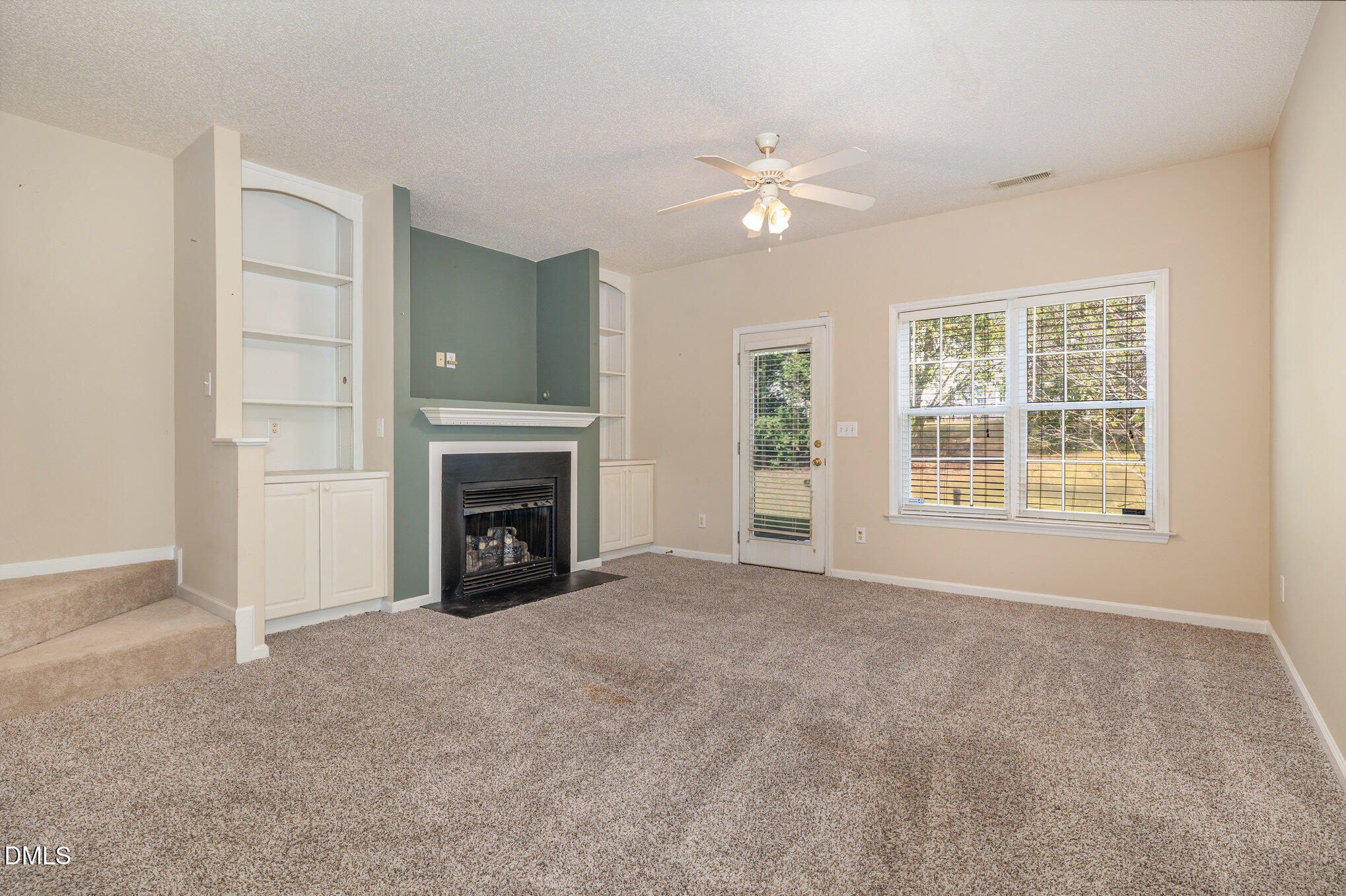 2116 Metacomet Way Raleigh, NC 27604 - Photo 3 of 24 a view of an empty room with window and fireplace