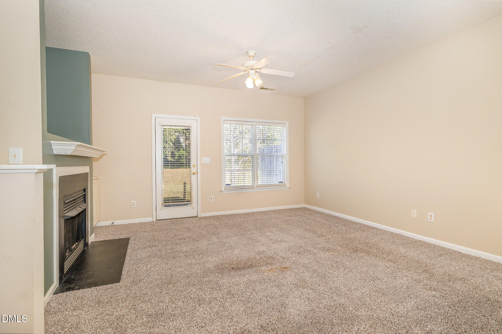 2116 Metacomet Way Raleigh, NC 27604 - Photo 4 of 24 a view of livingroom with window fireplace